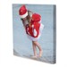Foto auf Leinwand Mädchen in Weihnachtskleid am Meer