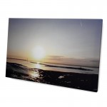 Eine Foto Leinwand mit einem Foto von einem Strand bei Sonnenuntergang