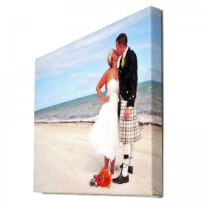 Foto auf Leinwand drucken mit einem Foto eines Hochzeitspaares am Strand